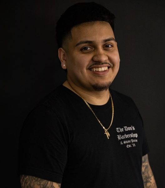 Chriz L., owner and master barber